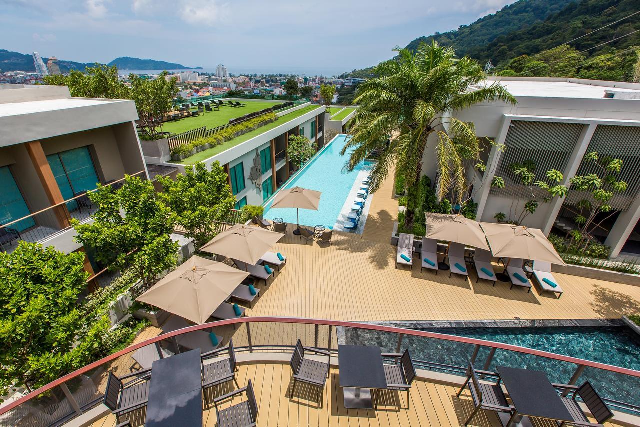 Fusion Suites Phuket Patong Bagian luar foto The swimming pool at the hotel